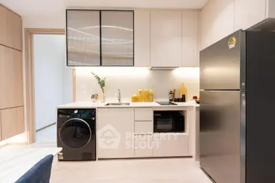 Modern kitchen with sleek appliances and stylish cabinetry