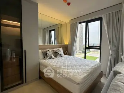 Modern bedroom with large window and stylish decor in urban apartment