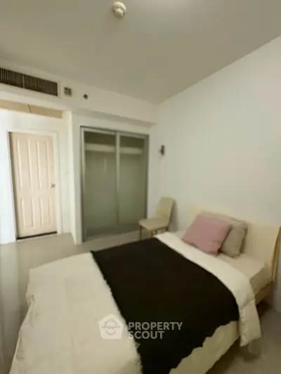 Cozy bedroom with modern decor and sliding closet doors