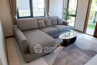 Modern living room with stylish gray sectional sofa and elegant decor
