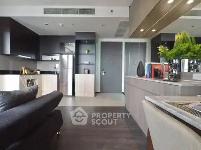 Modern open-layout kitchen with sleek cabinetry and stainless steel appliances