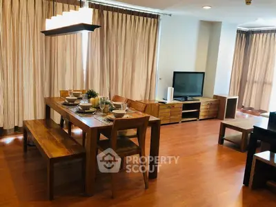 Spacious living room with elegant wooden dining set and modern decor
