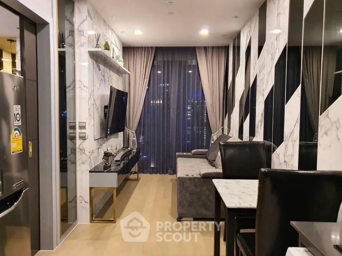 Modern living room with marble accents and city view, featuring sleek furniture and ambient lighting.