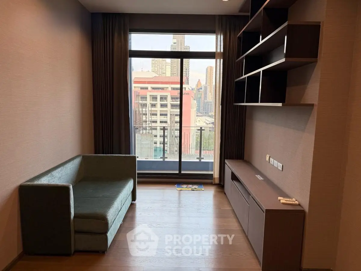 Modern living room with city view, featuring sleek shelving and a cozy sofa, perfect for urban living.