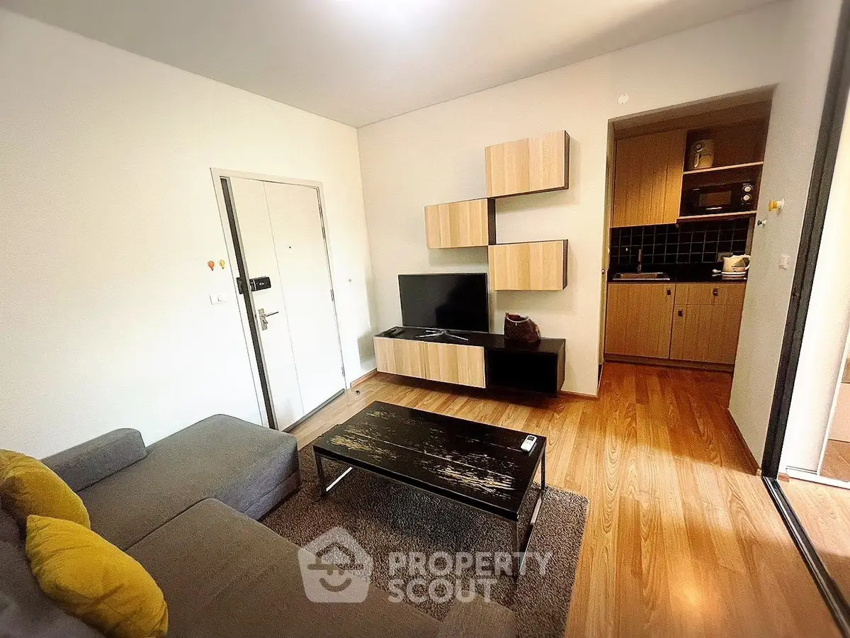 Modern living room with stylish furniture and open kitchen layout