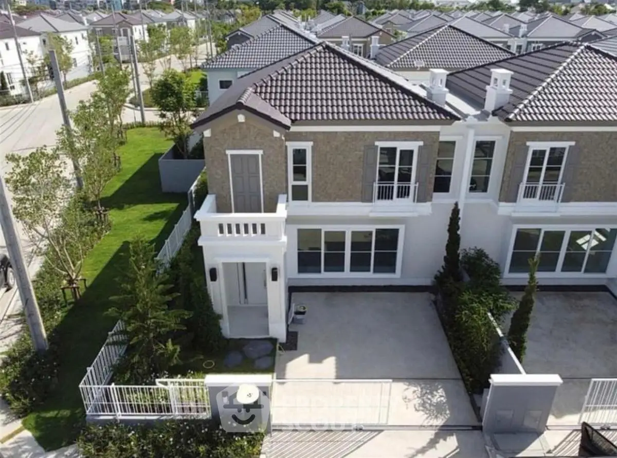 Stunning modern townhouse with elegant design and spacious driveway in a serene neighborhood.