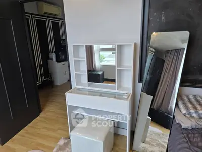 Modern bedroom with stylish vanity and full-length mirror