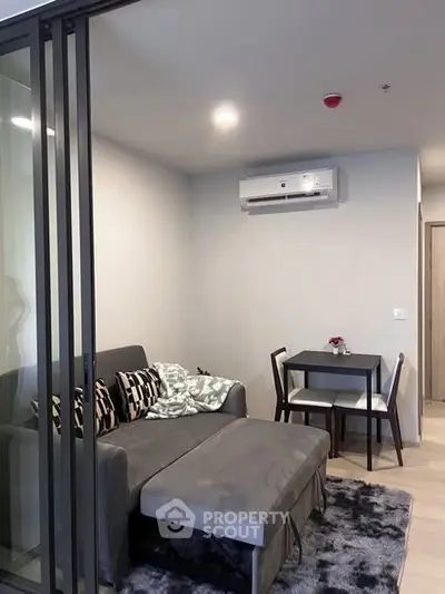 Modern living room with cozy sofa and dining area in a stylish apartment