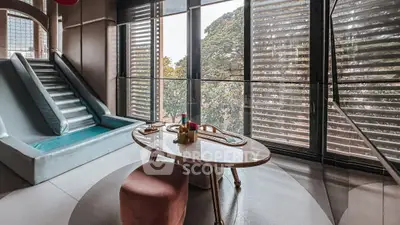 Luxurious modern living room with unique indoor slide and panoramic windows