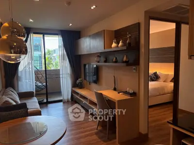 Modern living room with stylish decor and balcony access in a luxury apartment.