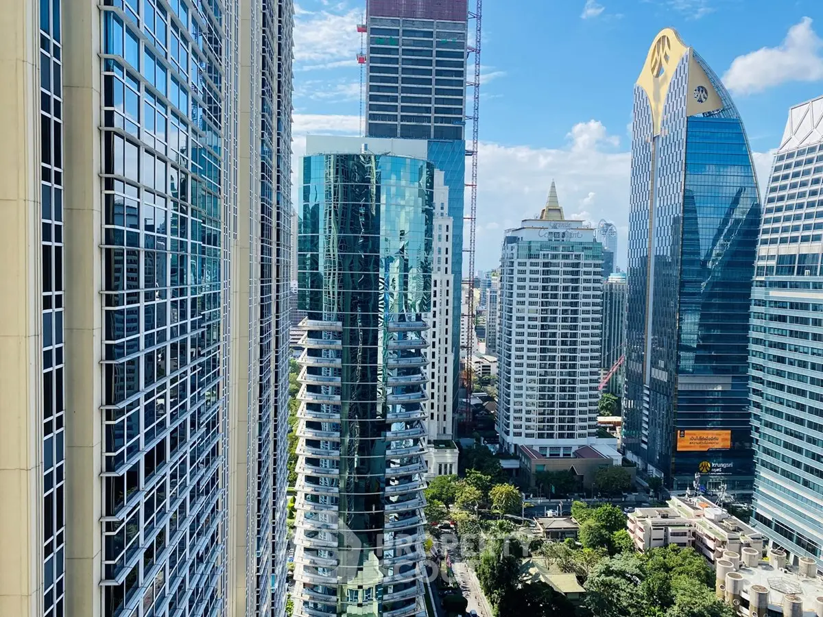 Stunning cityscape view with modern skyscrapers and lush greenery, showcasing urban living at its finest.