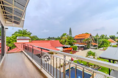 Stunning balcony view overlooking lush gardens and a serene neighborhood, perfect for relaxation and enjoyment.