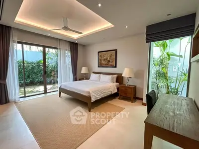 Spacious bedroom with garden view and elegant decor in modern home