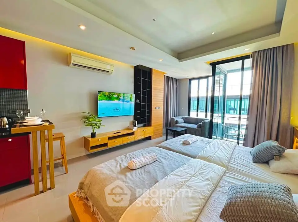 Spacious modern bedroom with balcony and stylish decor