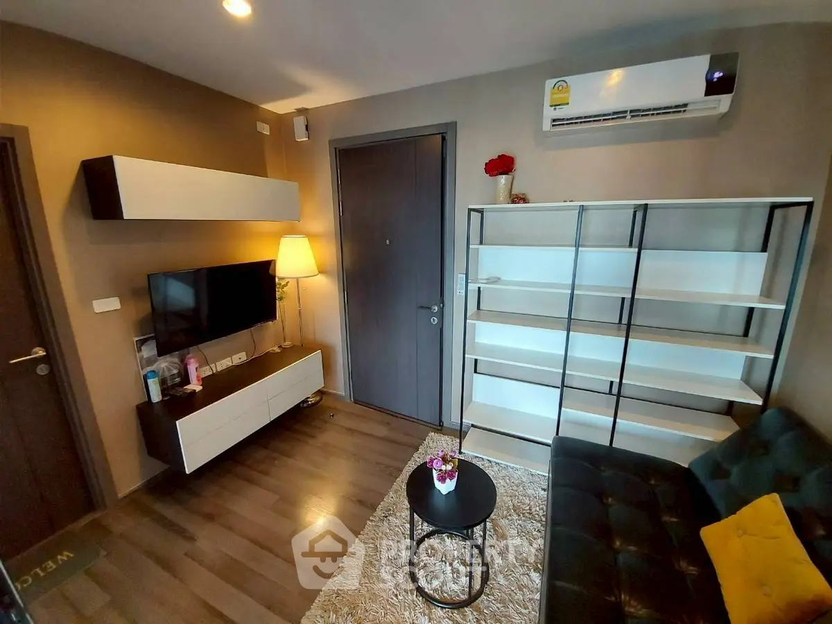 Modern living room with sleek furniture and air conditioning in a cozy apartment.