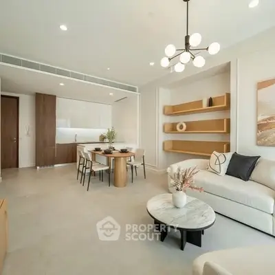 Modern open-plan living room with stylish kitchen and elegant decor