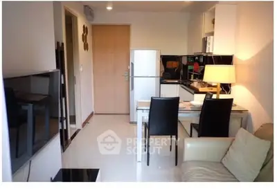 Modern apartment interior with sleek kitchen and cozy dining area