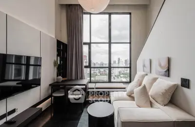 Modern living room with large window and city view, featuring stylish furniture and contemporary decor.