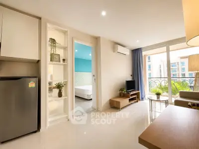 Modern living room with open layout and balcony view in a stylish apartment.