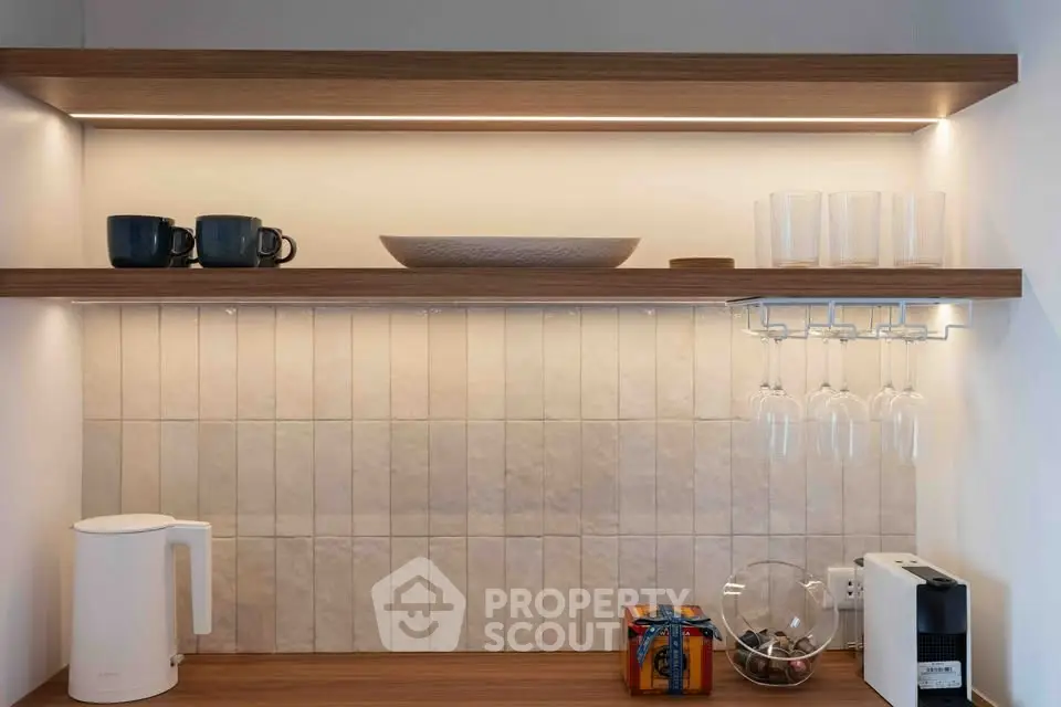 Modern kitchen with open shelving and stylish lighting