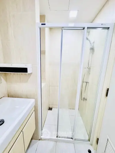 Modern bathroom with sleek shower and elegant fixtures