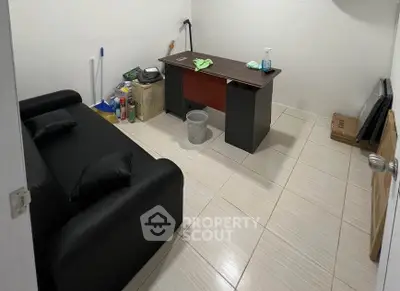 Compact home office with desk and sofa in minimalist design