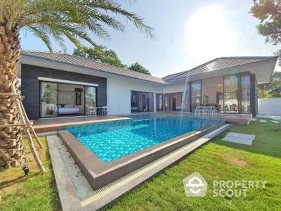 Luxurious modern villa with private pool and lush garden, perfect for serene living.