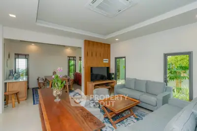 Spacious modern living room with elegant furniture and natural light