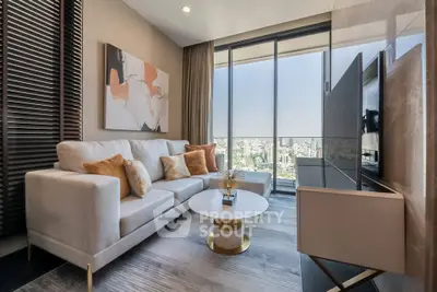 Luxurious living room with city view, modern decor, and plush seating in high-rise apartment.