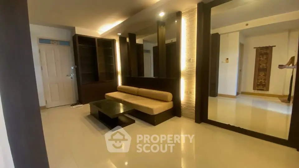 Modern living room with sleek design and ambient lighting