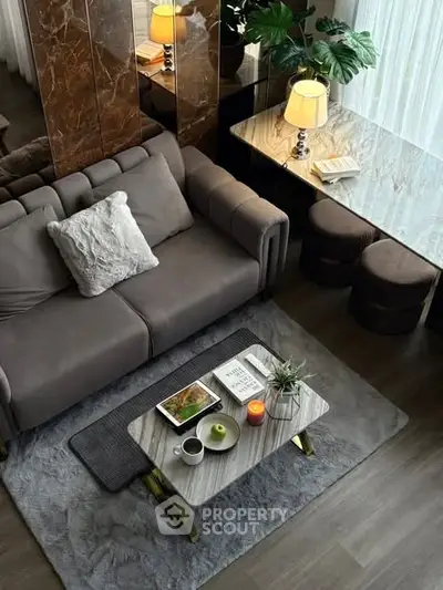 Luxurious modern living room with elegant decor and cozy seating area.