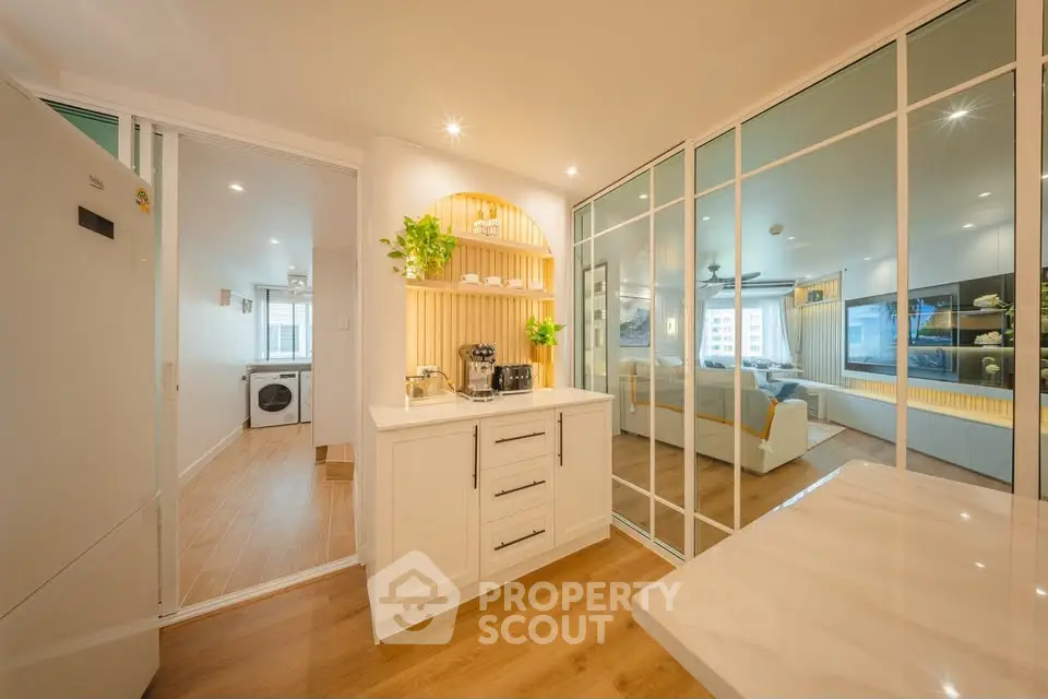 Modern kitchen with open layout and sleek appliances in a stylish apartment