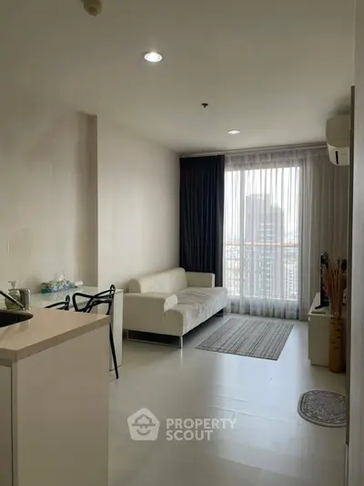 Modern living room with elegant sofa and city view through large window