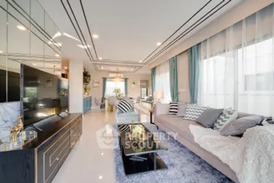 Luxurious modern living room with elegant decor and ample natural light