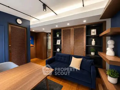 Stylish modern living room with blue accents and wooden elements, perfect for cozy gatherings.