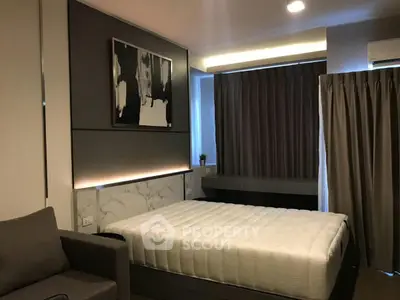 Modern bedroom with stylish decor and comfortable bed in a cozy apartment.