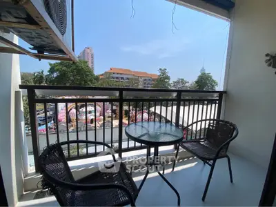 Charming balcony with outdoor seating and scenic view in urban setting