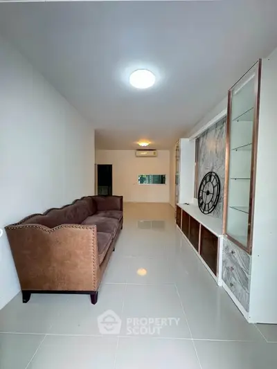 Spacious living room with elegant sofa and modern decor