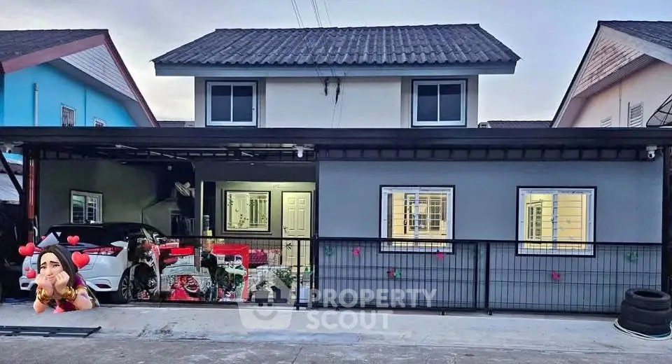 Charming two-story house with modern facade and spacious carport in suburban neighborhood.