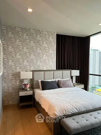 Luxurious bedroom with elegant decor and city view, featuring modern furniture and stylish wallpaper.