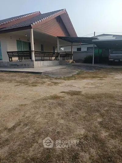 Charming single-story home with spacious carport and inviting front porch