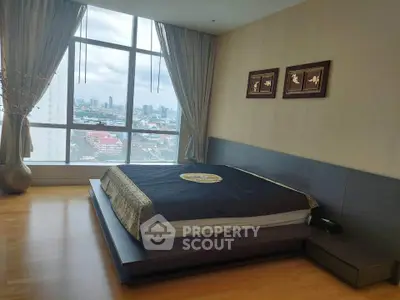 Luxurious bedroom with stunning city view and elegant decor