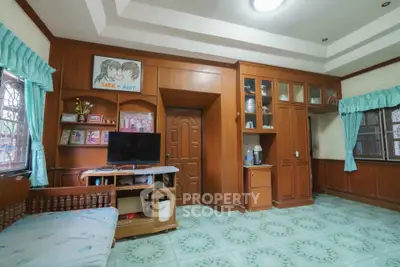 Charming living room with wooden paneling and vintage decor