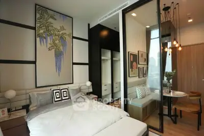 Modern bedroom with stylish decor and cozy dining nook in a contemporary apartment.