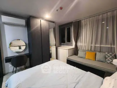 Cozy modern bedroom with stylish decor and ample natural light