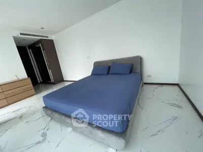 Spacious bedroom with modern design and elegant flooring