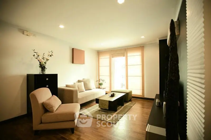 Spacious living room with modern decor and natural light