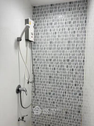Modern bathroom with stylish geometric tile shower and sleek fixtures