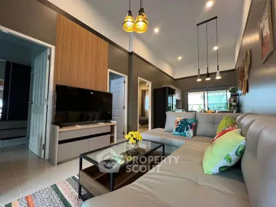 Modern living room with stylish decor, cozy sectional sofa, and ambient lighting for a welcoming atmosphere.