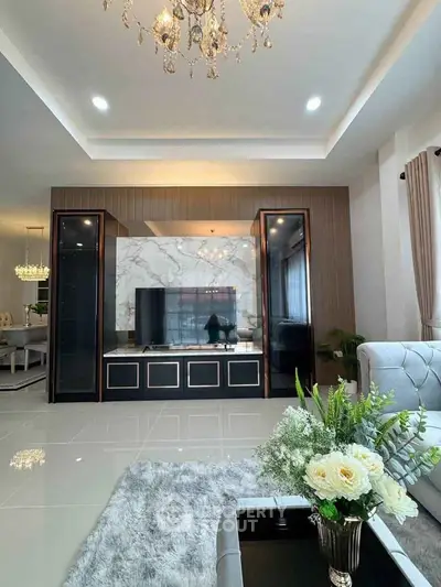 Luxurious living room with elegant chandelier and modern decor